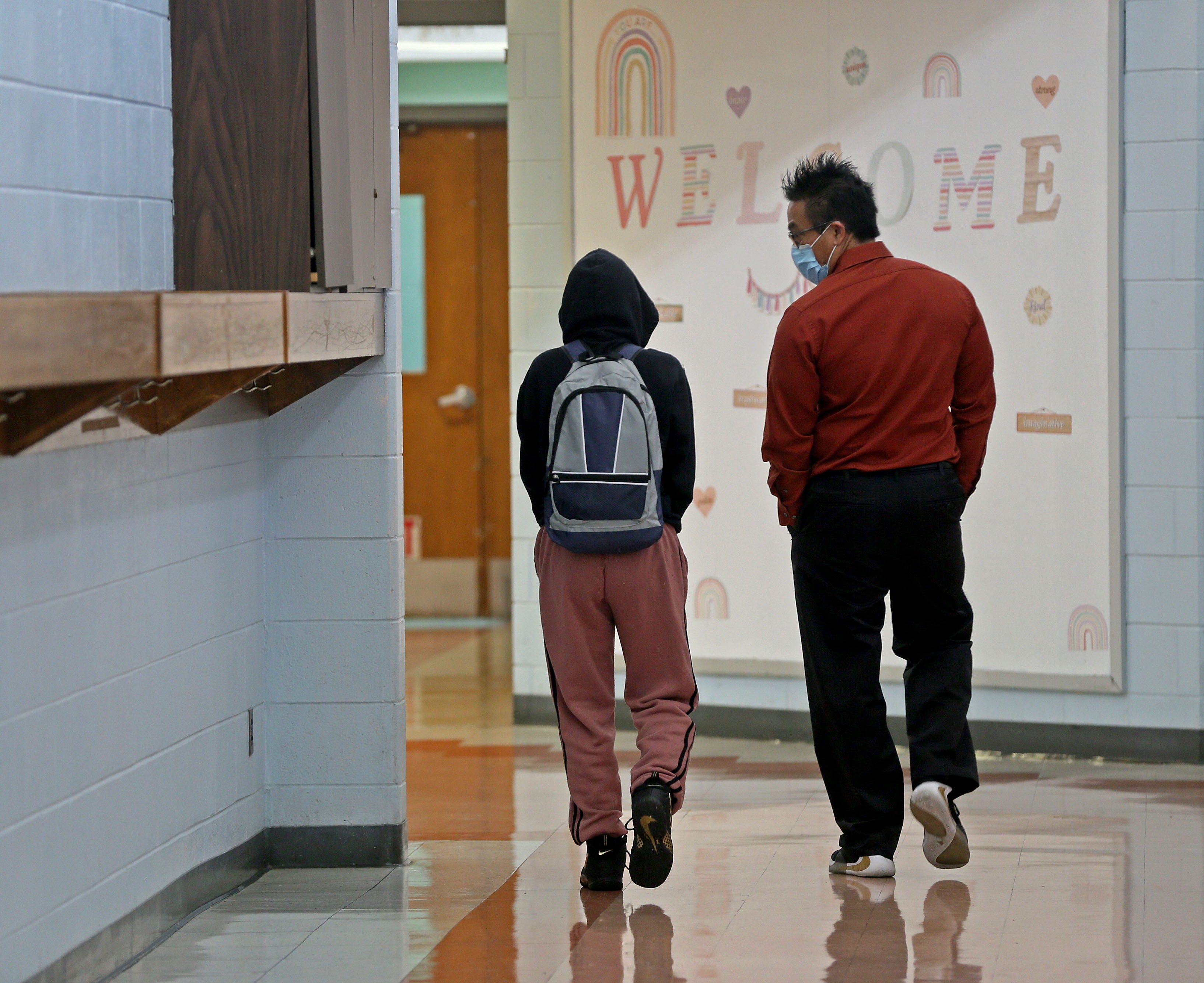 Assistant Principal Keith Omadahl, right, talks with a student at Starms Discovery Learning Center.