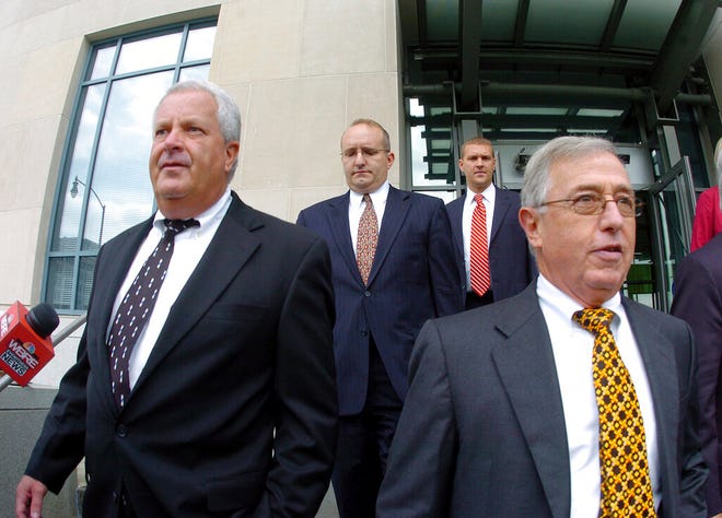 FILE - In this Tuesday, Sept., 15, 2009, file photo, former Luzerne County Court Judges Michael Conahan, front left, and Mark Ciavarella, front right, leave the United States District Courthouse in Scranton, Pa.  The two Pennsylvania judges who orchestrated a scheme to send children to for-profit jails in exchange for kickbacks were ordered to pay more than $200 million to hundreds of children who fell victim to their crimes.
U.S. District Judge Judge Christopher Conner awarded $106 million in compensatory damages and $100 million in punitive damages to nearly 300 plaintiffs in a long-running civil suit against the judges.(Mark Moran/The Citizens' Voice via AP)