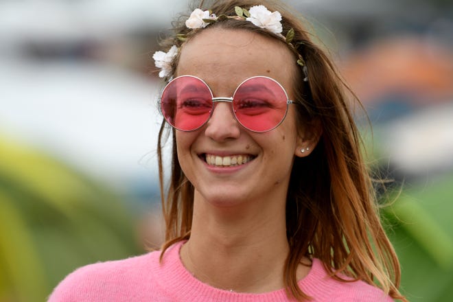 Expect hippie clothing and accessories like rose-colored glasses at the third Hippiefest at Causey Mansion Bed & Breakfast in Milford on Saturday. Pictured is a woman dressed in the festival theme of 'hippie' poses in Carhaix-Plouguer, western France on July 14, 2017, during the second day of the 26th edition of the 'Vieilles Charrues' music festival.