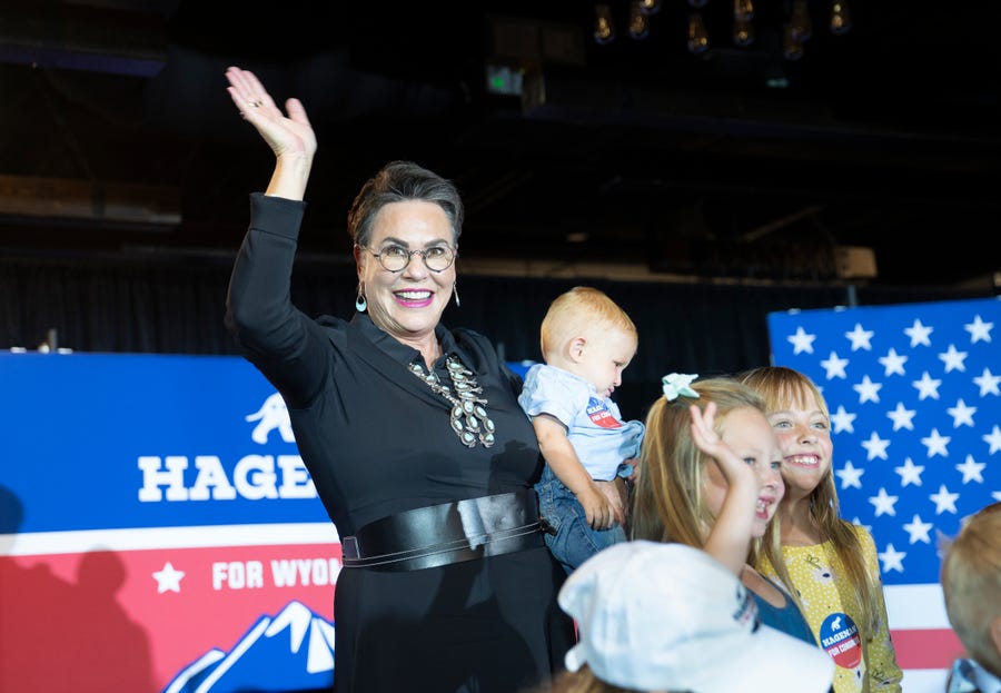 Wyoming Republican congressional candidate Harriet Hageman waves as she takes a picture with children during a primary election night party on August 16, 2022 in Cheyenne, Wyoming.