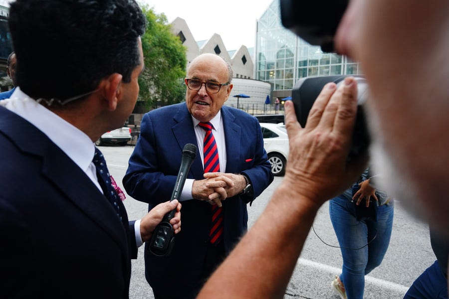 Rudy Giuliani walks into the Fulton County Courthouse to appear before a grand jury aiding in the Fulton County district attorney's investigation. Giuliani is a target of the ongoing criminal investigation into Georgia's 2020 elections.