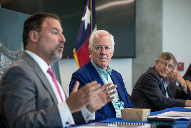 U.S. Sen. John Cornyn, R-Texas, center, and Port of Corpus Christi Chairman Charles Zahn Jr., right, listen to port CEO Sean Strawbridge speak during a visit to the port on Wednesday, Aug. 17, 2022.