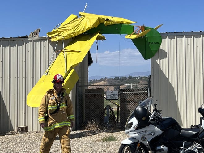 Emergency personnel investigate the crash of an ultralight craft Thursday at the Camarillo Airport that left the pilot in critical condition.