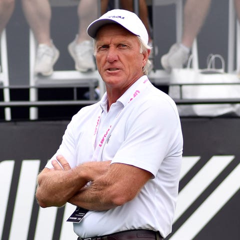 Greg Norman looks on from the first tee box during
