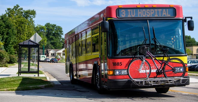 A Bloomington Transit Route 3 bus drives along Woodcrest Drive on Friday, Aug. 19, 2022.