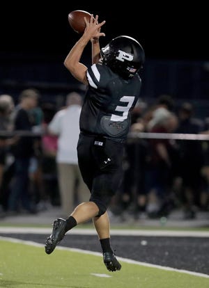 Perry's Carson Basham makes a touchdown catch against Central Catholic in a high school football at Perry on Thursday, August 18, 2022.