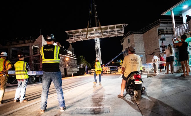 The pedestrian bridge that connects the Margaritaville properties on Fort Myers Beach was placed over Estero Boulevard in the early morning hours of Friday.  