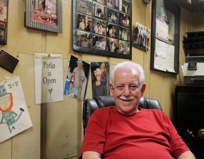 Ron Abraham in his office at Stables Bar and Grill in Livonia. Abraham recently celebrated his 80th birthday, complete with a surprise event at the bar on Middlebelt.