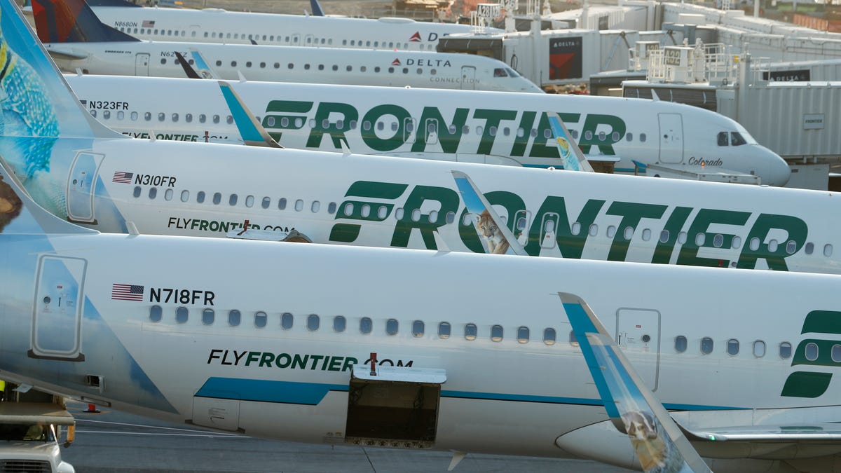 In this late Wednesday, June 26, 2019, photograph, Frontier Airlines jetliners sit at gates on the A concourse at Denver International Airport in Denver. (AP Photo/David Zalubowski) ORG XMIT: OTKDZ109