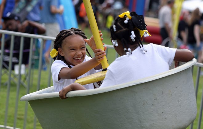 Summer Lawson, 7, and Kaylee Gibbs, 7, ride