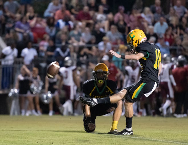 Jacob Wilkinson (18) kicks an extra point to give the Crusaders a 7-0 lead during the Tate vs Catholic varsity Kickoff Classic football game at Pensacola Catholic High School in Pensacola on Friday, Aug. 19, 2022.