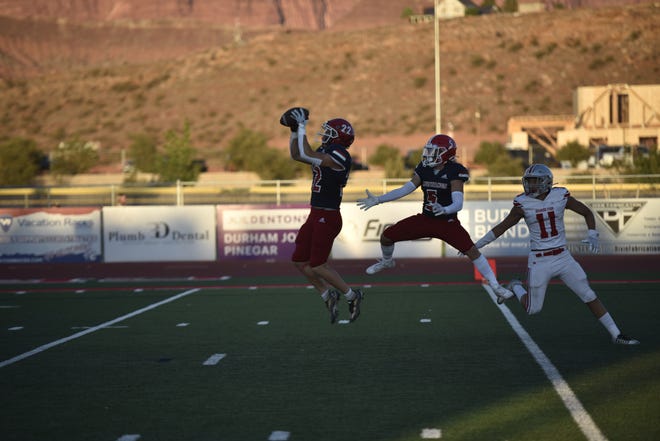 Fatafehi Faoneleua picks off a pass by Will Dart, setting up Crimson Cliffs' first touchdown in a 53-7 rout of Spanish Fork on Friday night.