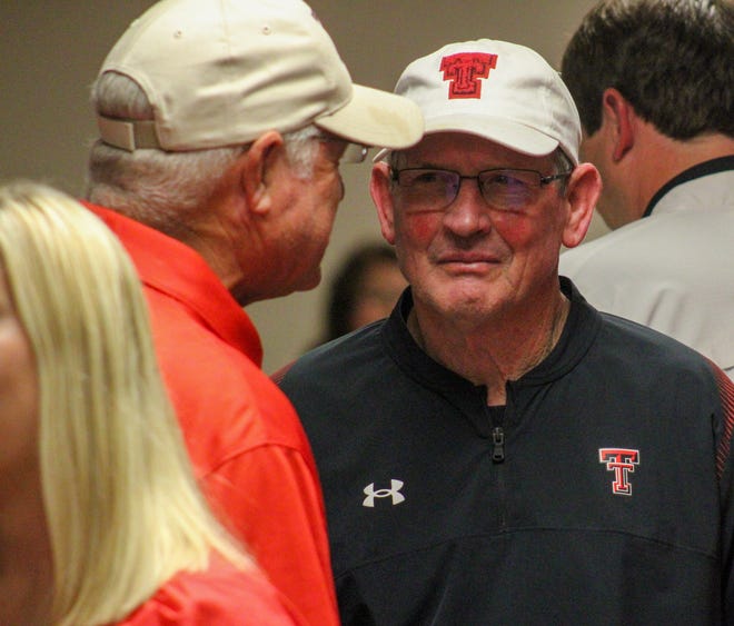 Former Texas Tech quarterback Rodney Allison chats with attendees at Saturday's Knights of Columbus Tech Night kickoff event. Allison was a special guest honoree. He plans to retire next summer after 10 years as director of the Double T Varsity Club letterwinners' organization.