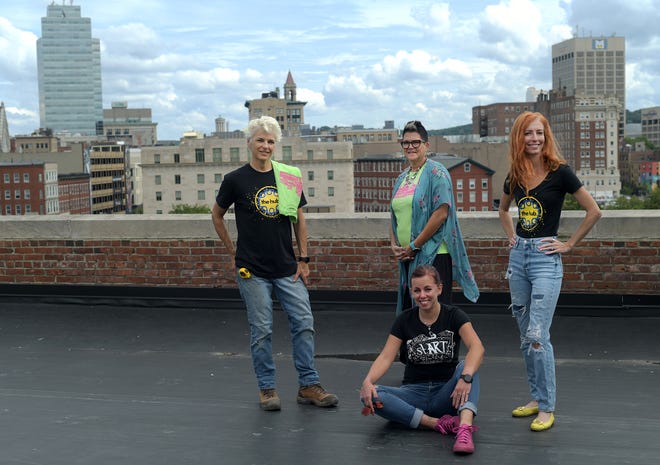 stART on the Street organizers Stacy Lord, Tina Zlody, Laura Marotta and Nikki Erskine on a rooftop at the Creative Hub, overlooking the city.