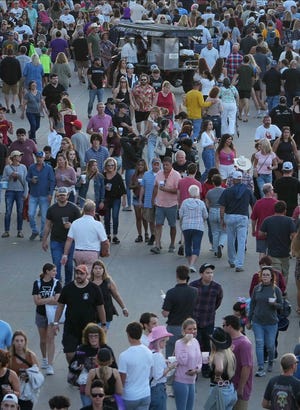 Large crowds make their way along Grand Avenue during the Iowa State Fair on Saturday, Aug. 20, 2022 in Des Moines.