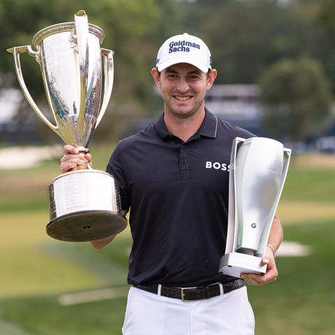 Patrick Cantlay posses with the trophies after win