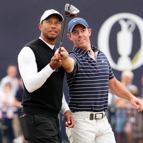 Tiger Woods, left, and Rory McIlroy during the R&A