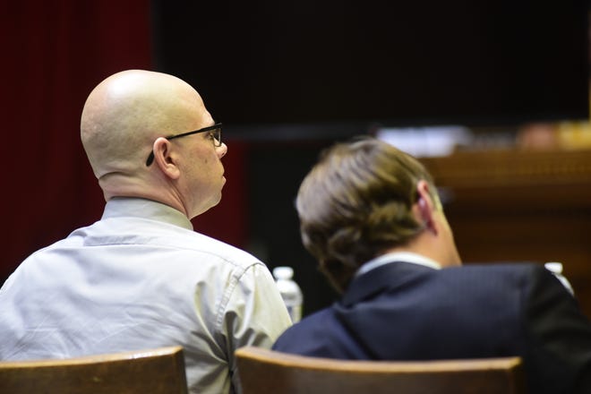 Jason Tupps and his attorney, James J. Mayer III, listen Monday morning to instructions given by visiting Judge Howard Hall.
