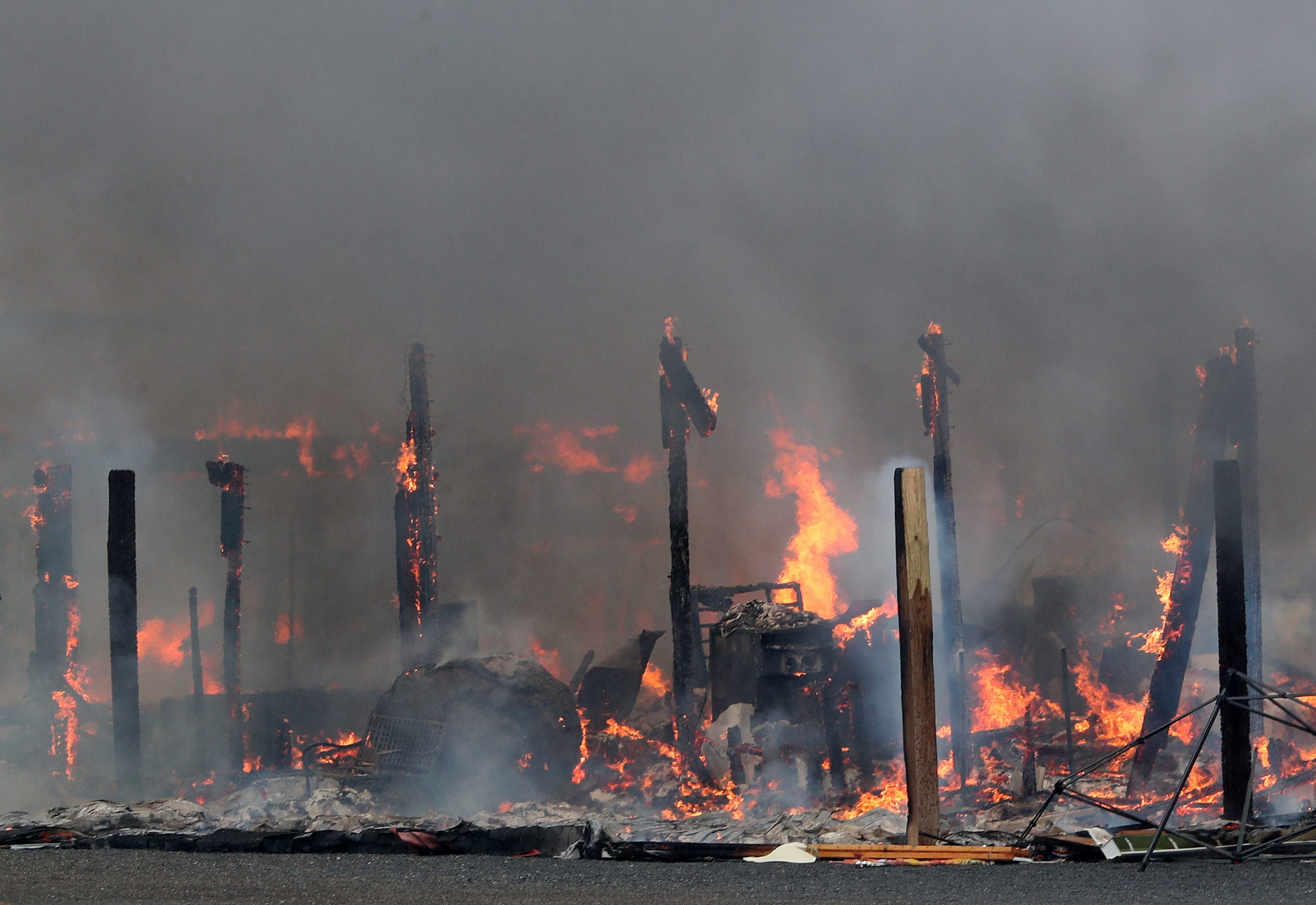Firefighters from several Dutchess County departments battle a multi-alarm fire at Barton Orchards in Beekman Aug. 22, 2022.