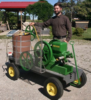 Jacob Miller's portable ice cream maker powered by a vintage John Deere hit-and-miss gas engine is easy to find at any event he attends.