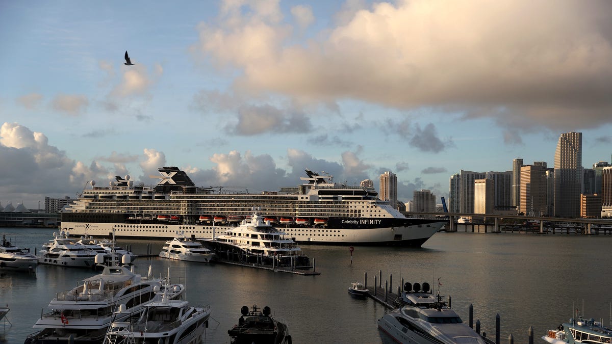 In this drone image, the Celebrity Infinity Cruise ship returns to  PortMiami from a cruise in the Caribbean as the world deals with the coronavirus outbreak on March 14, 2020 in Miami, Florida.