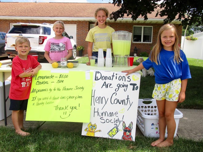 Four young Geneseo lemonade stand owners, from left, Blake DeSplinter, Savanna DeSplinter, Paige Sides and Kinsley Sides, decided to operate their business for charity.  The group raised $280 for the Henry County Humane Society – Geneseo in one afternoon, with their sales of lemonade and cookies. Many people stopped and left a donation without taking a cookie or a glass of lemonade, but wanted to support the Humane Society.