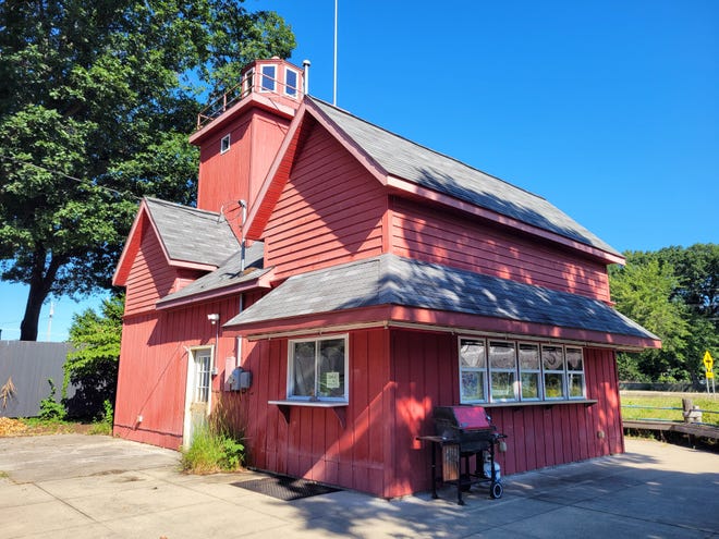 According to Russ Shilander, owner of Beechwood Grill — which shares a parking lot with the miniature replica of Big Red — the small lot used to hold a house.