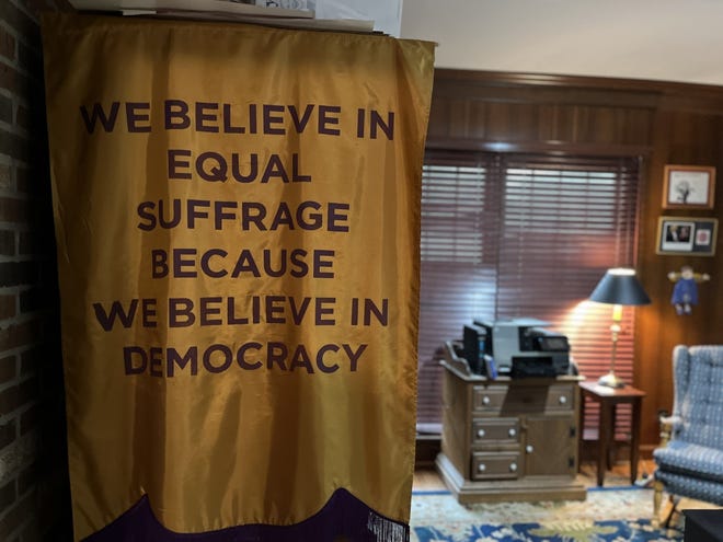 Replica of a flag used during women's rights marches. This flag was in an exhibit at the Frazier History Museum about the women's suffrage movement.