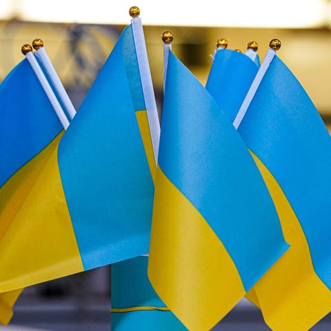 A vendor sells Ukrainian flags at the With Love Uk