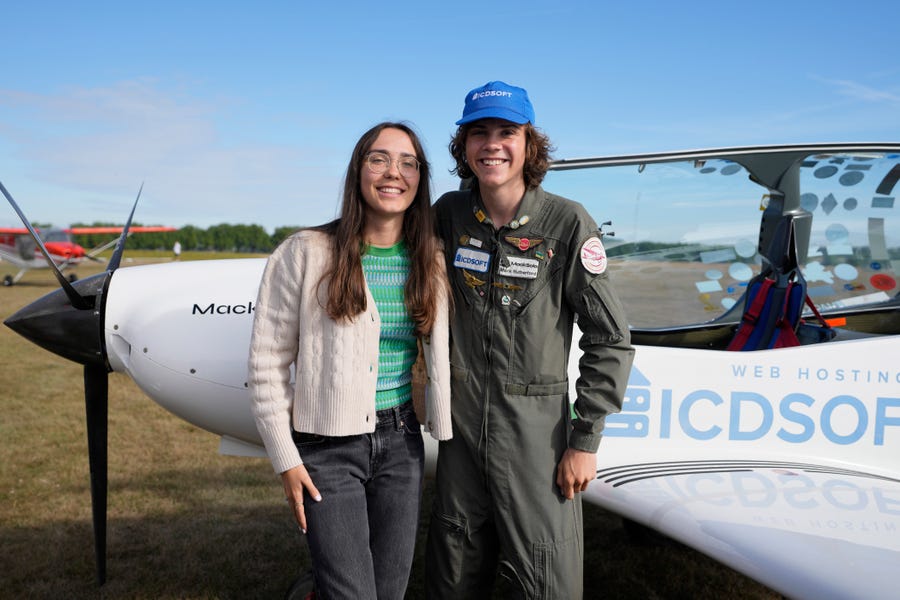 Seventeen year old Anglo-Belgian pilot, Mack Rutherford, right, poses with his sister Zara Rutherford after landing at the Buzet airfield in Pont-A-Celles, Belgium, Tuesday, Aug. 23, 2022.