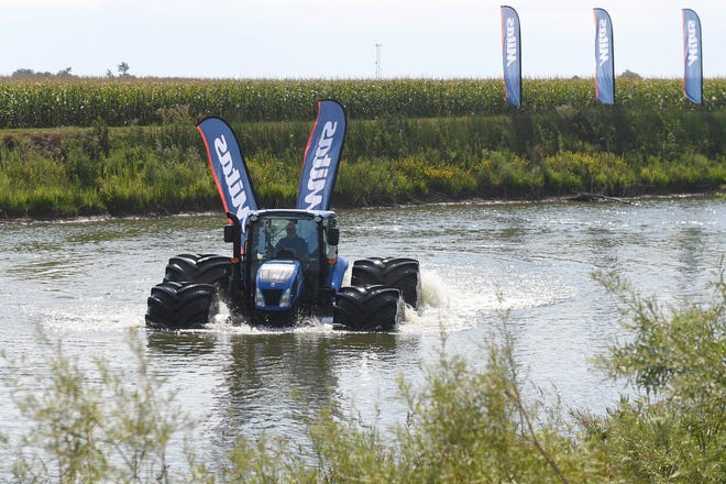 Mitas demonstrates its tires that allow a tractor to float on Wednesday, Aug. 24, 2022, in Boone, Iowa. The tires will be showcased at the Farm Progress Show next week.