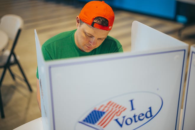 Local resident Nathan Bates casts his vote in Oklahoma's recent primary run-off election.