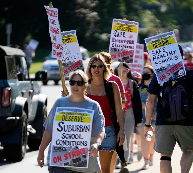 Teachers, parents and students walk the picket line at Whetstone High School on Wednesday.