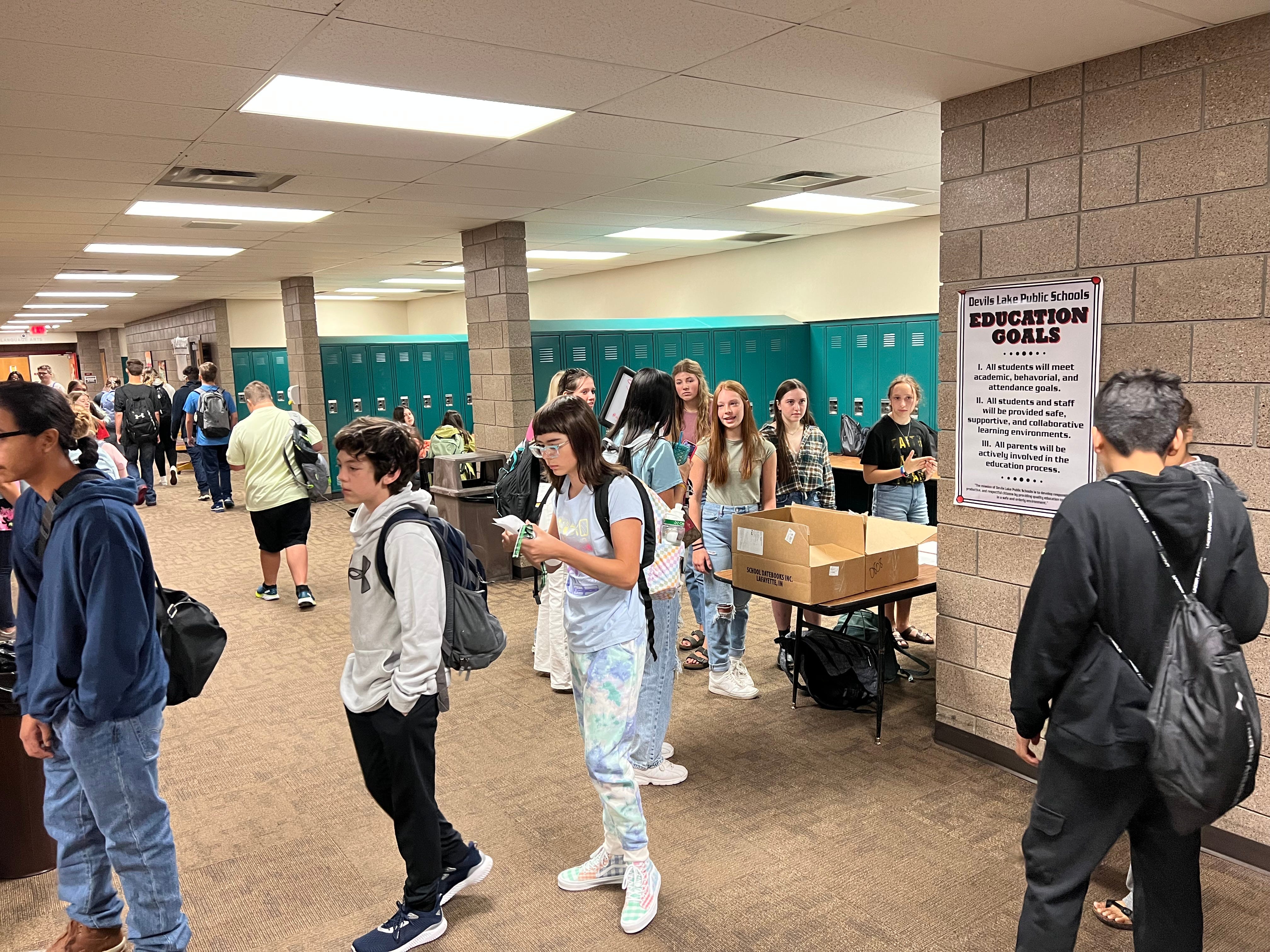 Students line up outside of the office in order to pick up schedules and materials.