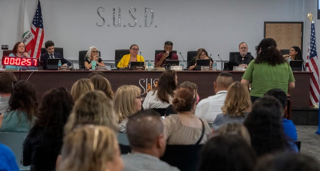 The Stockton Unified School District board trustees during a regular board meeting at the district's headquarters in downtown Stockton on Aug. 23.
