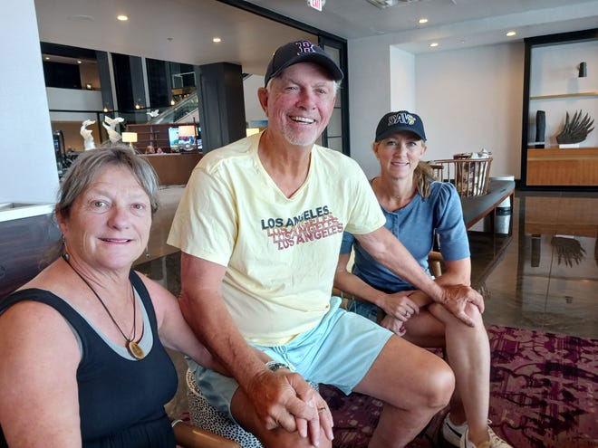 Former major league pitcher Bill Lee, 75, sits with his wife Diana, left, and his daughter Caitlin Burkes for an interview at a Savannah hotel. The former All-Star for the Boston Red Sox has continued to pitch since his last MLB game in 1982 unless sidelined by injury. He pledges to keep pitching, including for the Savannah Bananas.
