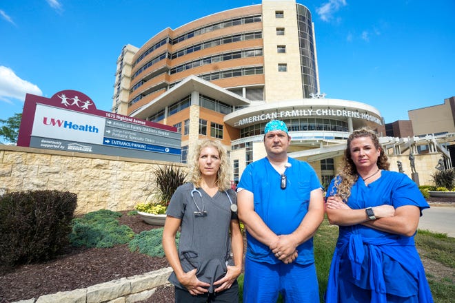 From left, UW Health System nurses Shari Signer, Zach Sielaff and Mary Jorgensen stand Tuesday in front of the American Family Children's Hospital in Madison. On Wednesday, nurses voted to strike if the administration continues to deny their request for union recognition.