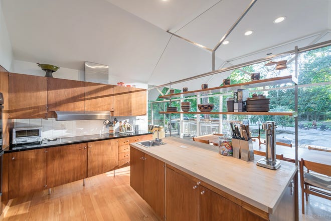 The original walnut kitchen has been restored by current owners of this mid-century modern house in Farmington, designed by award-winning architect William Kessler for carpet and flooring mogul Arthur Beckwith in 1960.