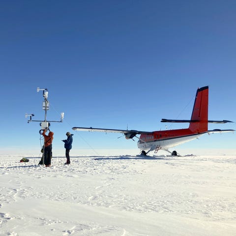 A glaciologist team for the Geological Survey of D