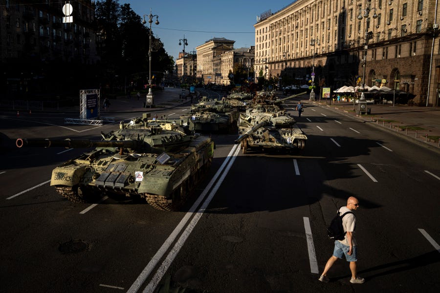 Destroyed Russian military vehicles installed in downtown Kyiv, Ukraine, Wednesday, Aug. 24, 2022. Kyiv authorities have banned mass gatherings in the capital through Thursday for fear of Russian missile attacks. Independence Day, like the six-month mark in the war, falls on Wednesday.
