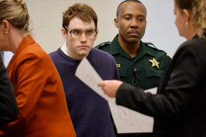 Marjory Stoneman Douglas High School shooter Nikolas Cruz is escorted into the courtroom during the penalty phase of Cruz’s trial at the Broward County Courthouse in Fort Lauderdale on Aug. 24. Cruz previously plead guilty to all 17 counts of premeditated murder and 17 counts of attempted murder in the 2018 shootings.