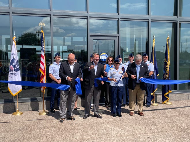 Pictured (from left) are LSSU President Rodney S. Hanley, Senator Gary Peters, Coast Guard Admiral Jo-Ann Burdian and Sault Ste. Marie Mayor Don Gerrie cutting the ribbon to open the Coast Guard Great Lakes Center of Expertise on Aug. 24 in Sault Ste. Marie.