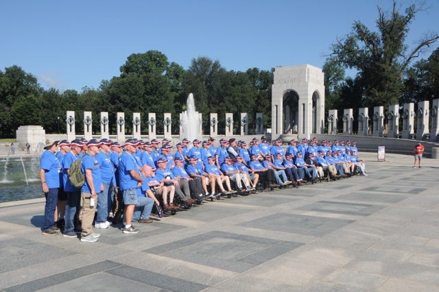 Springfield-area veterans gather for a group photo at the World War II Memorial during the Honor Flight of the Ozarks trip to Washington, DC on Aug. 23, 2022.