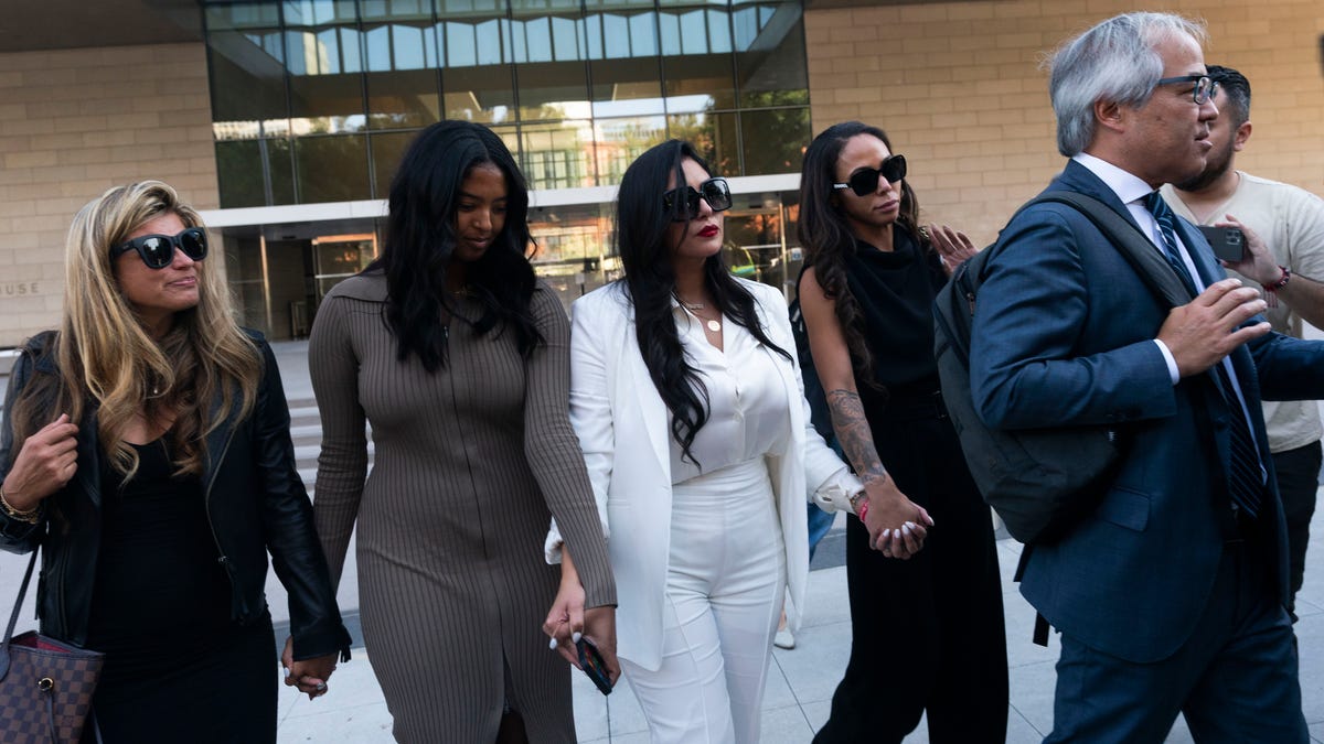 Vanessa Bryant, center, leaves a federal courthouse with her daughter, Natalia, center left, and soccer player Sydney Leroux, center right.