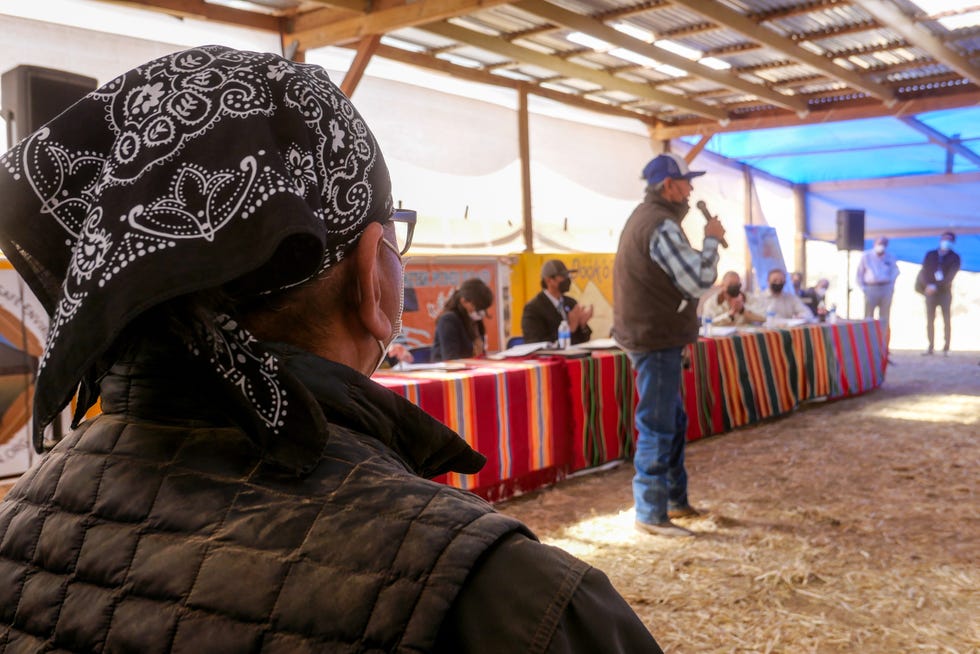 Dariel Yazzie, left, listens to testimonials of former uranium mine workers and residents of the Red Water Pond Road community near the Church Rock mine site at a gathering of the Nuclear Regulatory Commission, Navajo Nation and the Environmental Protection Agency in April. 