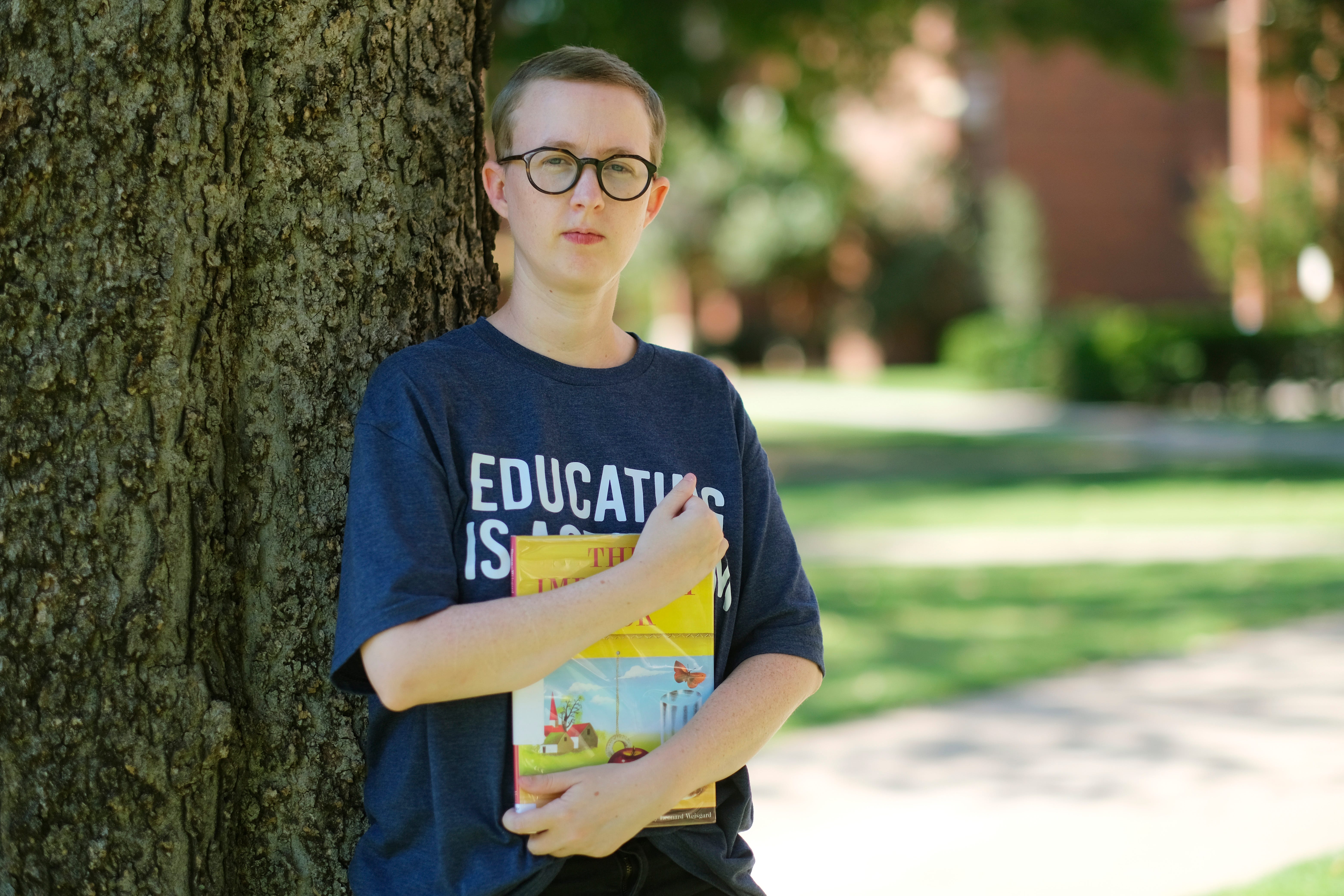 Summer Boismier, a teacher who resigned from Norman High School, is shown on Aug. 26, 2022, on the University of Oklahoma campus. The former English teacher covered bookshelves in her classroom at Norman High School in response to House Bill 1775, a state law banning certain race and gender concepts from schools. Boismier resigned after a parent complained of the display.
