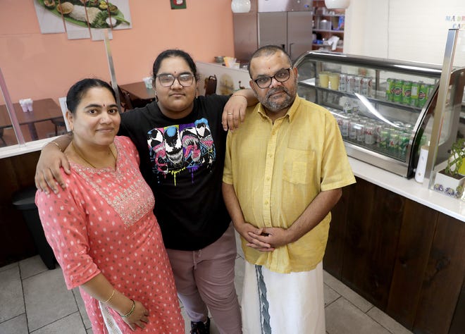 Rama Srinivasan, left, daughter Sam Srinivasan and Srinivasan Aravamudan in their family business,  Madras Café, at 819 W. Wisconsin Ave. in Appleton