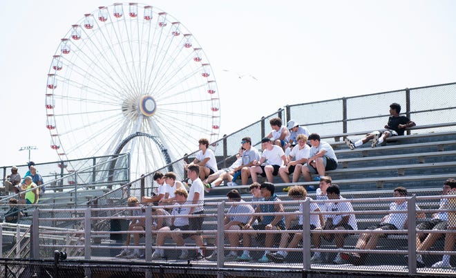 Spectators watch the football game between Salem and Cedar Grove played during the second annual Battle at the Beach football showcase at Ocean City High School on Friday, August 26, 2022. 