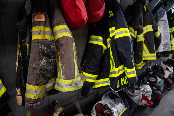 New fire jackets hang amongst older used jackets at the Tallassee Fire Department in Tallassee, Ala., on Friday, Aug. 26, 2022.