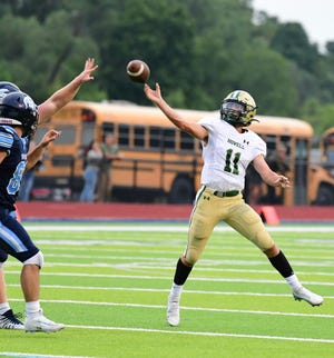 Howell's Dru Taylor passes under pressure during an 18-0 victory over Livonia Stevenson on Thursday, Aug. 25, 2022.